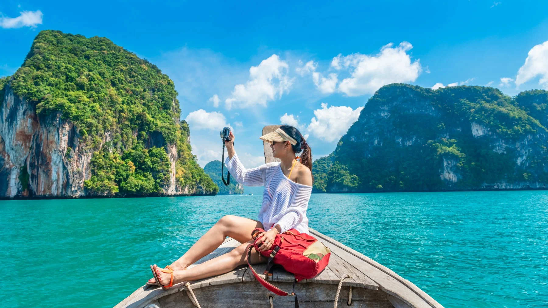 Traveller exploring Phi Phi’s limestone coastline